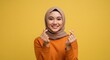 © nadine - Happy Muslim Woman Showing Mini Heart Sign