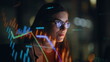 © stockbusters - Stock market trader working hologram night closeup. Diagrams projected on face