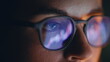 © stockbusters - Eyes glasses reflecting diagrams at dark place closeup. Concentrated trader face