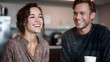 © Thares2020 - Two colleagues share a joyful moment laughing heartily during an indoor coffee break