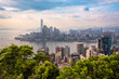 View to Hong Kong city, China from above. Skyscrapers and green plants