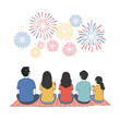 © Creative_art - Five people sit on a blanket watching fireworks