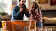 © medi - Excited couple celebrating during a game night with drinks and cups