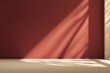 © Sathaporn - Minimal modern studio background with dark red textured wall and light beige marble surface illuminated by natural sunlight shadows