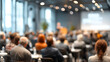 © Axtra - business seminar room blurred background filled with people attending speech corporate professional meeting workshop training session networking leadership discussion learning conference