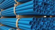 © Kowshala - Stacked Blue PVC Pipes Industrial Material blue pipes plastic pi