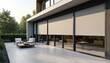 © miss irine - Modern house exterior features large windows covered by closed roller blinds providing privacy, sun protection. Clean design of building showcases stylish facade with patio area, outdoor furniture.