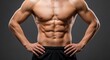 © ulum - Anatomy of Power - A Mans Perfectly Chiseled Torso with Defined Abs in Dramatic Studio Lighting.