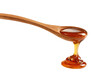 © Ona - Wooden spoon with honey dripping