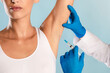 © Prostock-studio - Hyperhidrosis Treatment. Woman receiving underarm shot. Armpit injections to prevent excessive sweating, cropped. Plastic surgeon in gloves making jab at arm pits against profuse perspiration disorder