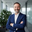 © Juwel_AI Designer - Confident Businessman Portrait with Arms Crossed in Modern Office Setting Smiling with Professionalism