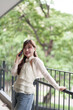 © snowing12 - Young Asian adult woman remote work business call outdoor happy relax freelance entrepreneur lifestyle technology communication urban nature