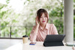 © snowing12 - Asian woman freelance remote work outdoors tablet use headphones coffee peaceful nature digital nomad lifestyle