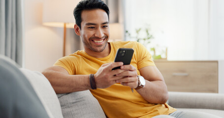 Phone, relax and happy man in home for internet, social media post and reading news. Cellphone, living room and person with app for online text, communication and check message with notification