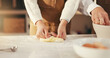 © peopleimages.com - Hands, parent and kid with baking dough in home for cookies, learning and development. Family, people and girl kneading pastry in kitchen for scones recipe, culinary skills and dessert preparation