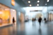 © Echo - Soft focus image of a brightly lit shopping mall interior with blurred people walking and storefronts on either side, creating an atmosphere of bustle