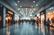 © Echo - A blurred indoor shopping center scene showing indistinct figures walking past shops with illuminated displays. Abstract and teal toned