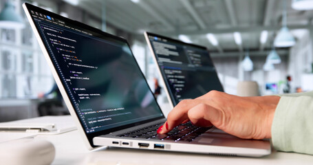 Busy Female Programmer Creating Software Code On Computer