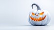 © sa-photo - White Halloween Pumpkin with Grinning Face and Orange Glow on Neutral Background for Spooky Theme Decorations