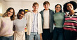 © peopleimages.com - Portrait, high school students and group with hug for support, academic development or learning. Teenager, boys and girls embrace in classroom together with smile, happiness or education with friends