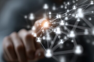 A persons finger touching a glowing digital network of interconnected user icons representing global communication and technology.