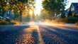 © Asmaa_Asmadi - Asphalt Road with Yellow Line, Hazy Sunlight and Trees.
