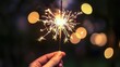 © bl3 - Close-Up of Hand Holding Sparkler Against Dark Background at Night, New Year Celebration Concept