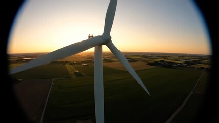Wall Mural - AI-Generated wind turbine at sunset and the surrounding rural landscape is green and flat.