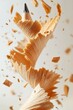 © อมรรัตน์ คําโสภา - Pencil shavings in motion, captured mid-air, dynamic spiral forms, isolated on soft background, motion freeze effect