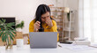 © David - Portrait of a Worried young asian woman using laptop computer at home, Sad, unhappy, Worried, Depression, or employee life stress concept