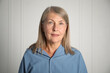 © New Africa - Portrait of beautiful senior woman near white wall