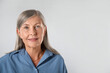 © New Africa - Portrait of beautiful senior woman on white background. Space for text