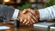 © Анастасія Шестопал - Close up shot of two business professionals shaking hands, symbolizing a successful agreement, partnership, and mutual trust.