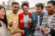 © Xavier Lorenzo - Young group of diverse gen z friends having fun celebrating with sparkles outdoors. New Year 2026 and celebration concept