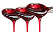 © Onyx - Dark red liquid drips from spoons