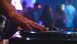 © intricateflow - Close-up cinematic view of a DJ’s hand expertly scratching and spinning a turntable in a vibrant neon-lit nightclub, capturing dynamic energy, rhythm, and electrifying nightlife atmosphere