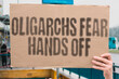 © AndriiKoval - 'Oligarchs Fear Hands Off' demanding freedom and rejecting elite control.POWER. WEALTH. JUSTICE. CONTROL. ELITE. RIGHTS. VOICE.