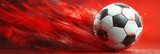 Dynamic close-up of a black and white soccer ball streaking through a vibrant red background with motion blur and splattered paint effects conveying intense energy and speed