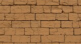 Authentic weathered adobe brick wall texture with intricate cracks, offering a rustic, natural backdrop for earthy designs and historical concepts.