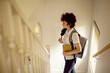 © Cavan Images - Teen age school girl with backpack going to school