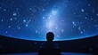 © Sobah - Person gazing at a simulated night sky in a planetarium.