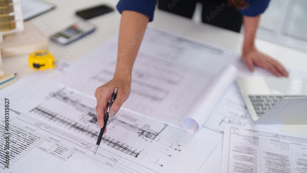 Architect professional examining detailed building blueprints planning ...