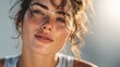 © suus - Alluring freckled woman radiating natural beauty in sunlit close-up