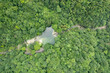 Jiugong Mountain in Xianning City, China shows lush green trees and a clear pool.
