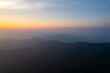 Jiugong Mountain in Xianning City, China displays layered mountain ranges under a gradient sky.