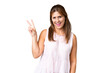© luismolinero - Middle age woman over isolated background smiling and showing victory sign