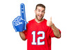 © luismolinero - sports fan man over isolated chroma key background with thumbs up because something good has happened