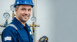 © Margarita Ratatosk - Smiling caucasian man in blue uniform and hardhat holding detector. Gas specialist inspecting city gas system. Industrial worker.