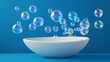 © Faziljan - Numerous iridescent soap bubbles float above a clean white bowl. Light reflects off vibrant spherical surfaces.