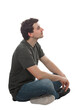 © 1STunningART - Side view of seated man dreamer thinking of ideas. Full length male portrait isolated on transparent background
